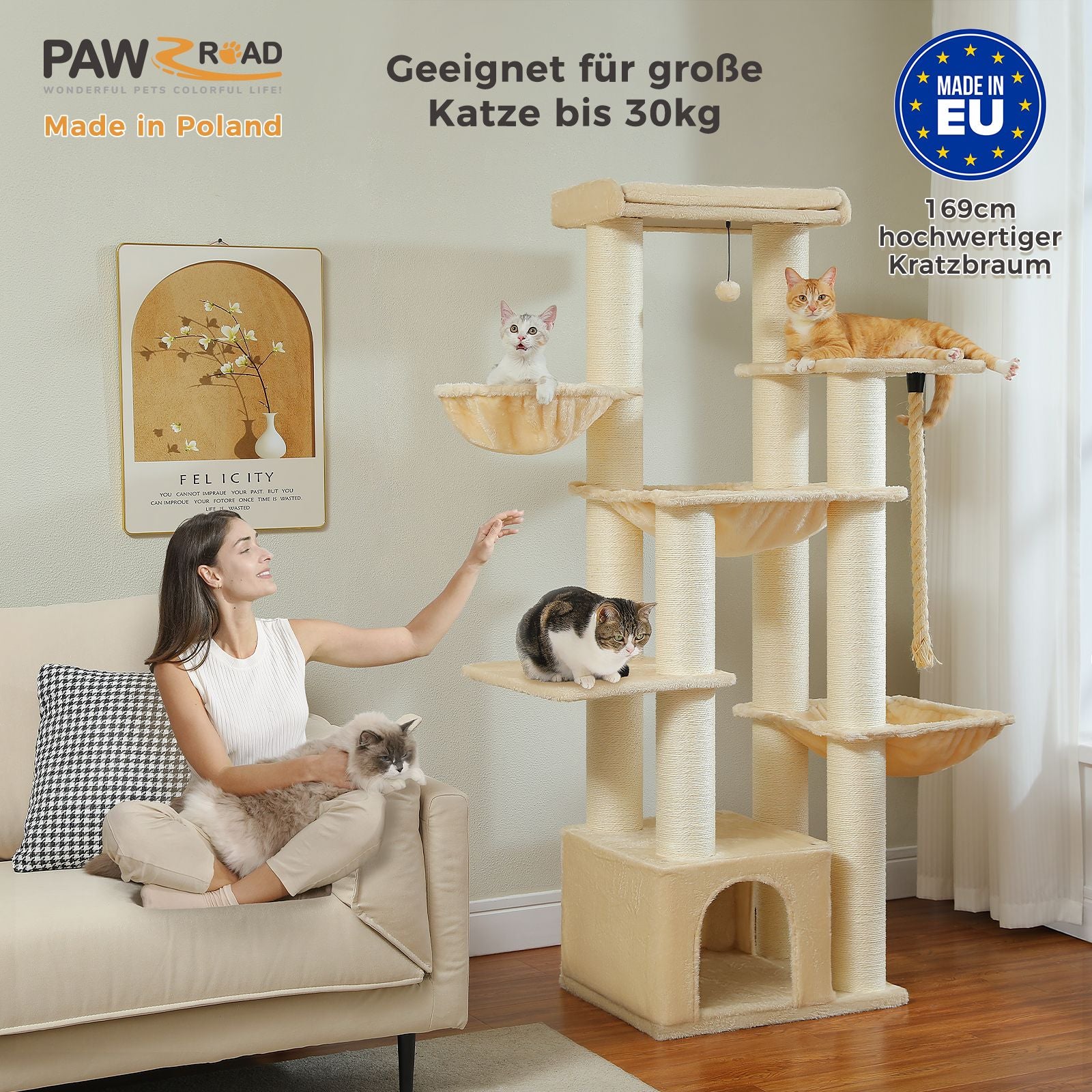 Woman sitting on a couch with cats, next to a multi-level cat tree in a living room.