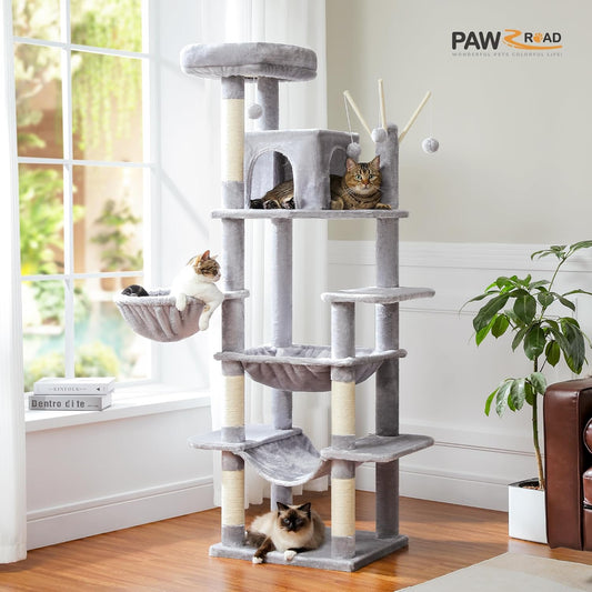 Cat tree with multiple levels and a cat sitting on top in a room with a window and plant.