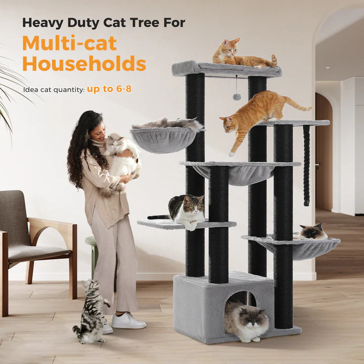 Heavy-duty cat tree for multi-cat households with multiple cats on shelves, woman holding a dog.